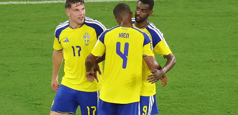 Swedish players celebrating on the field during match