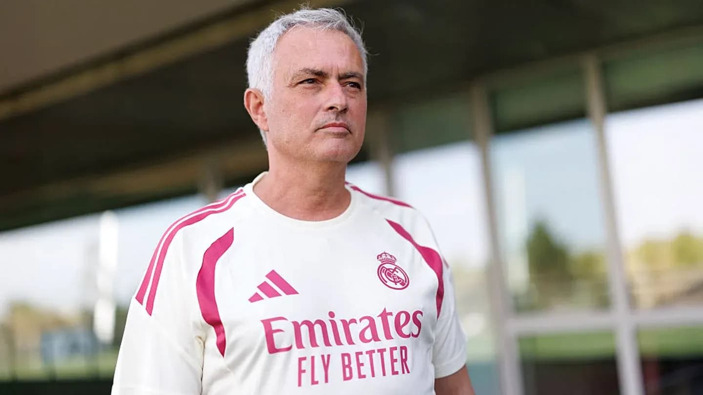 Coach in Real Madrid training kit outdoors