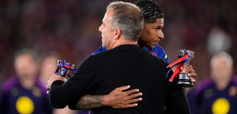Coach and player embracing with awards in hand