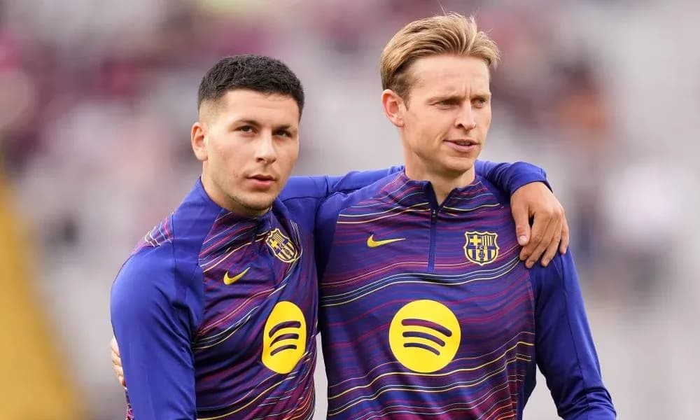 Two players in FC Barcelona training kits posing together