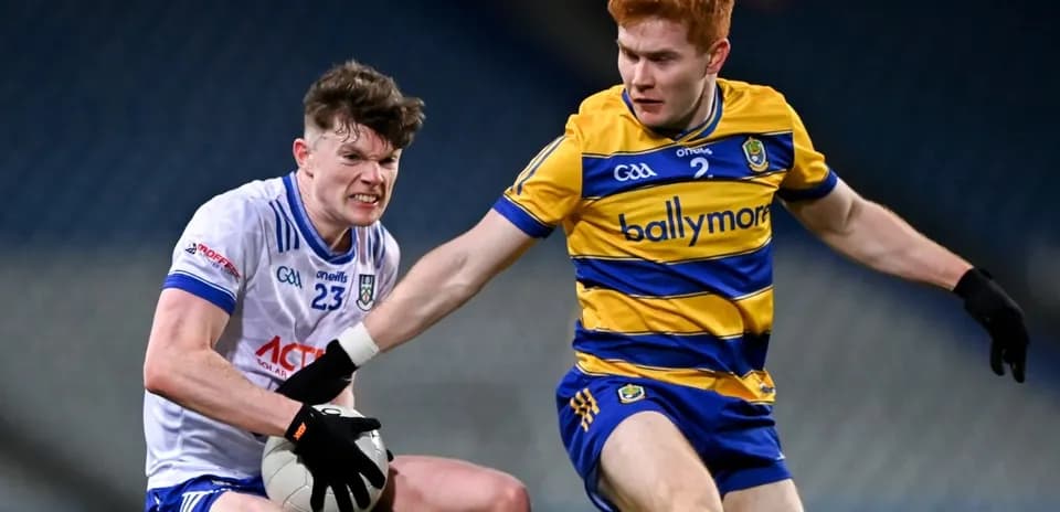 Two players contesting for a Gaelic football