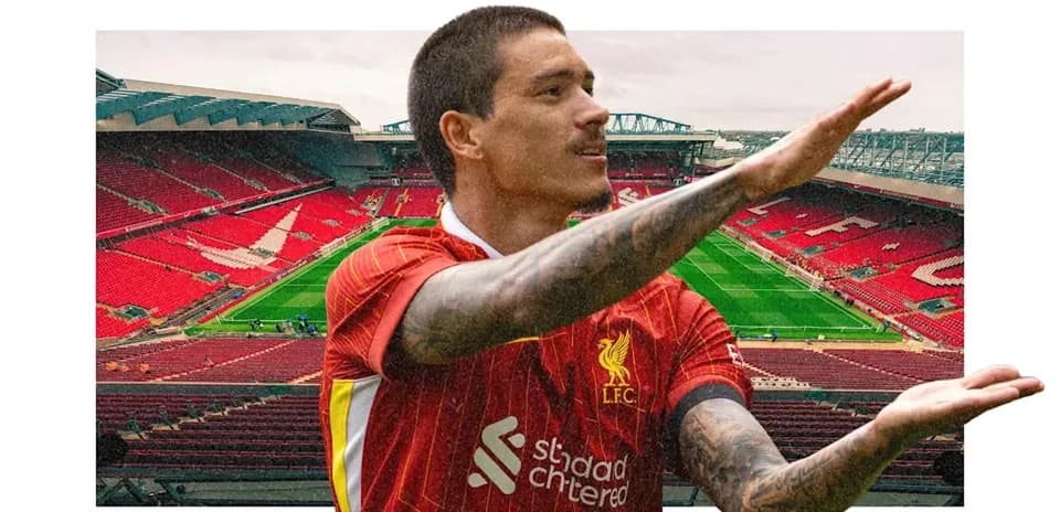 Player in Liverpool kit gestures at Anfield stadium