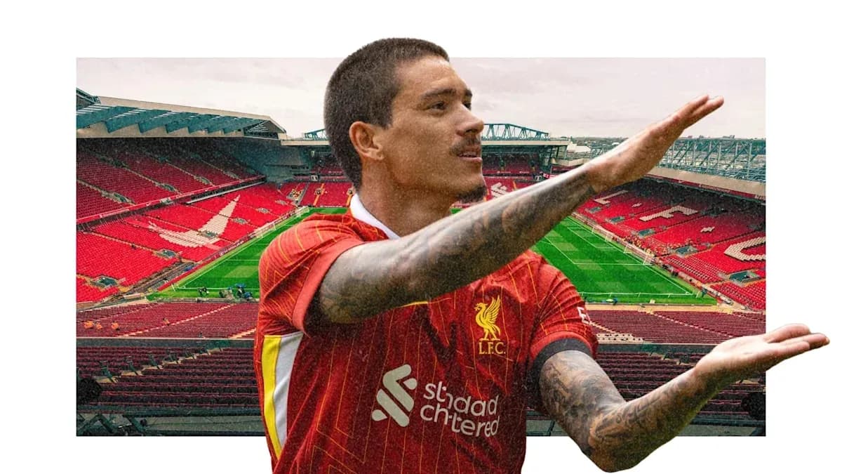 Player in Liverpool kit gestures at Anfield stadium