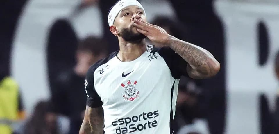 Player celebrating by blowing a kiss after scoring