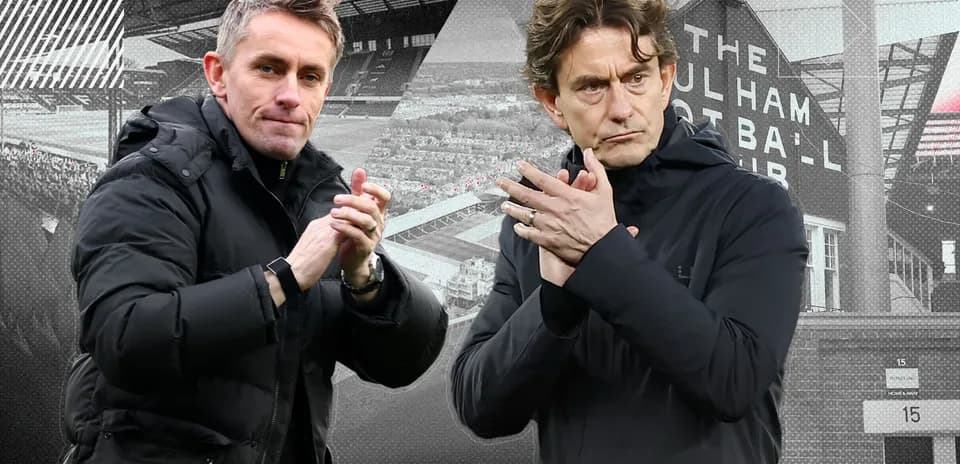 Two football managers clapping at a match