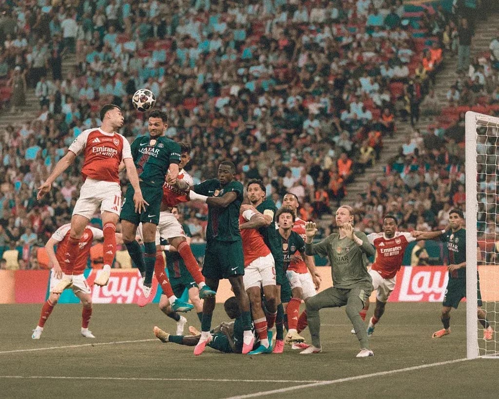 Players contesting for the ball during corner kick