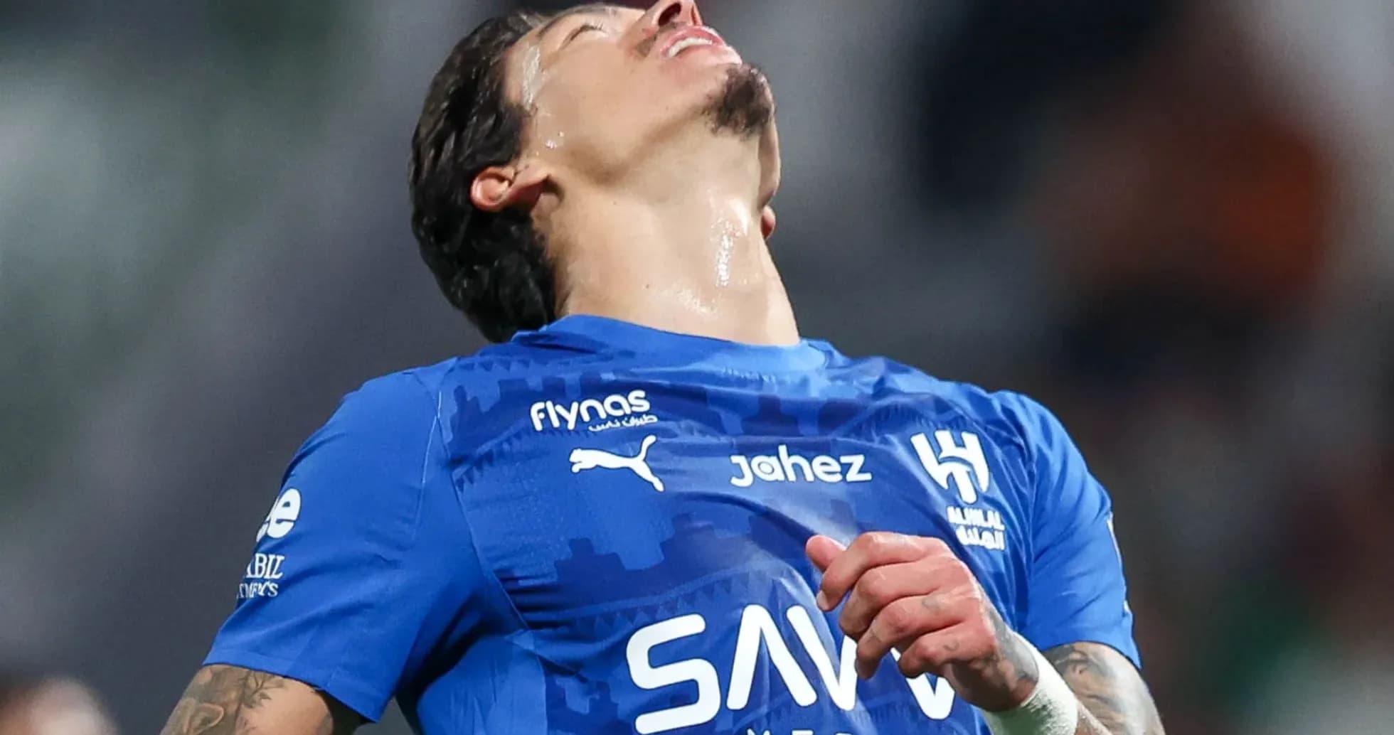 Player in blue jersey reacting on the field