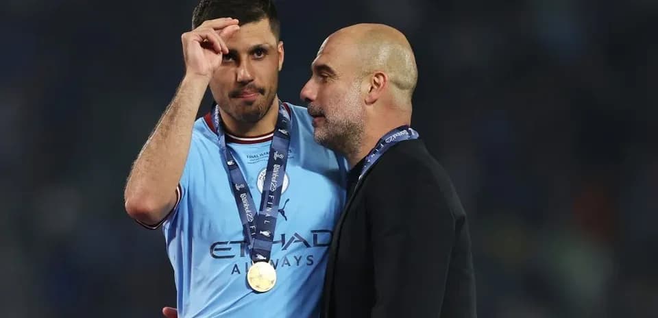 Player and manager celebrating victory with medals