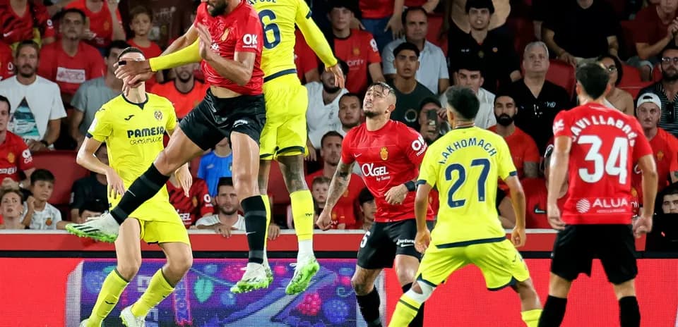 Mallorca player jumping for a header against Villarreal