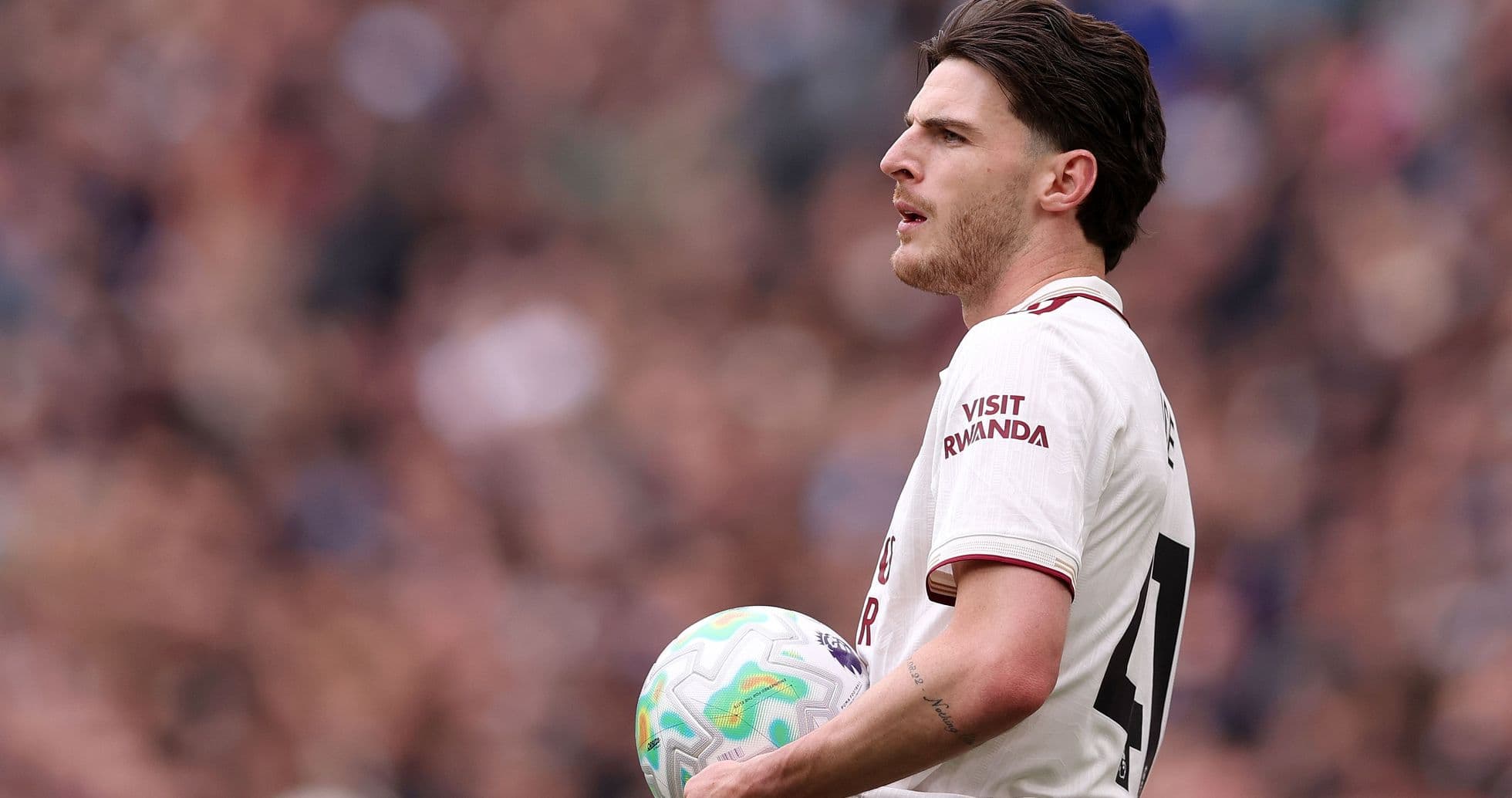 Player holding ball during match on field