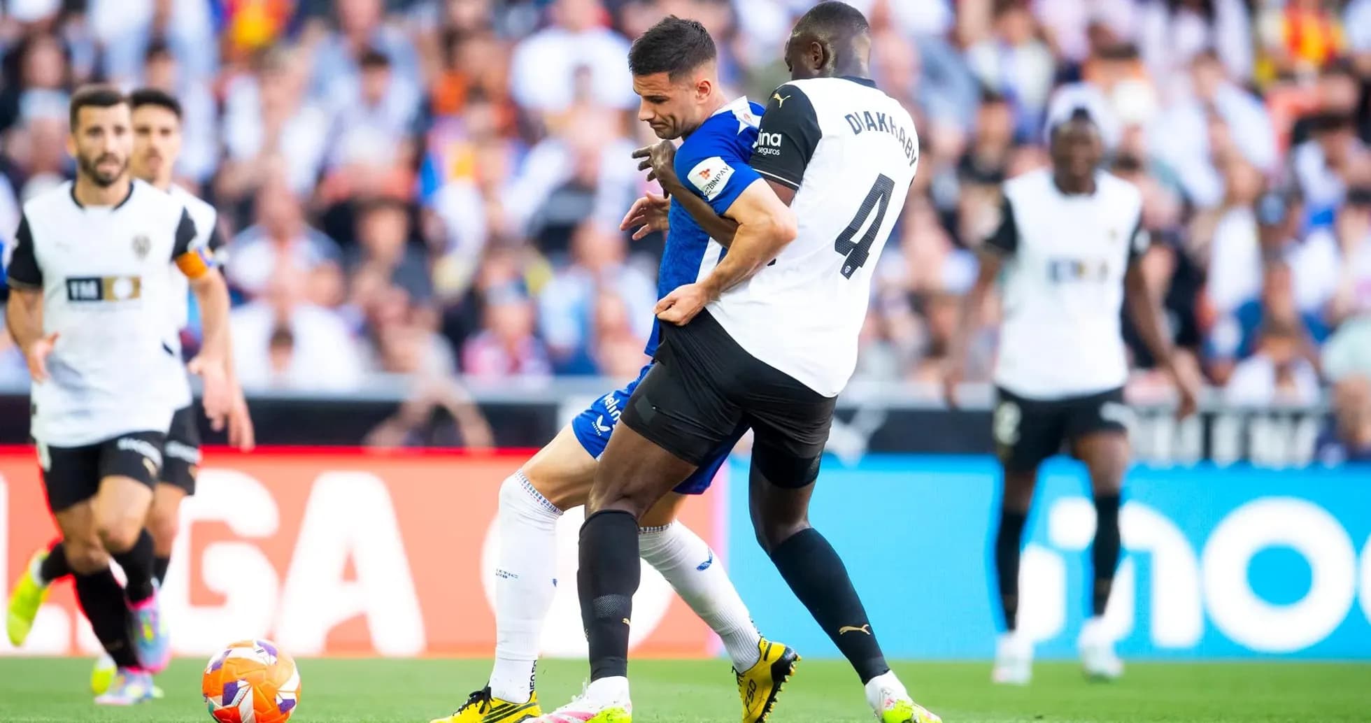 Players competing for the ball during La Liga match