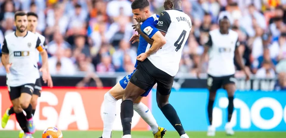 Players competing for the ball during La Liga match