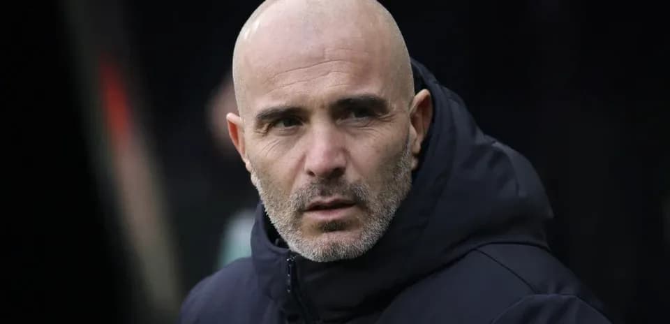 Coach observing from the sidelines during a match