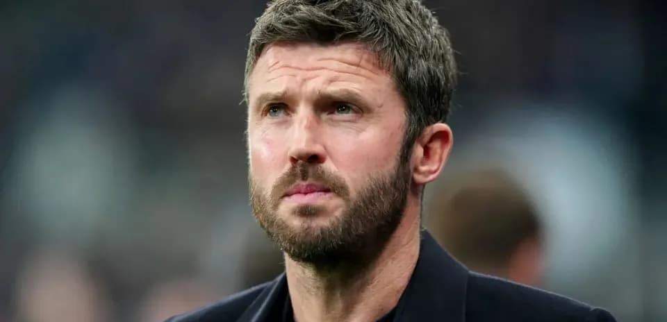 Man with beard looking intently off-camera