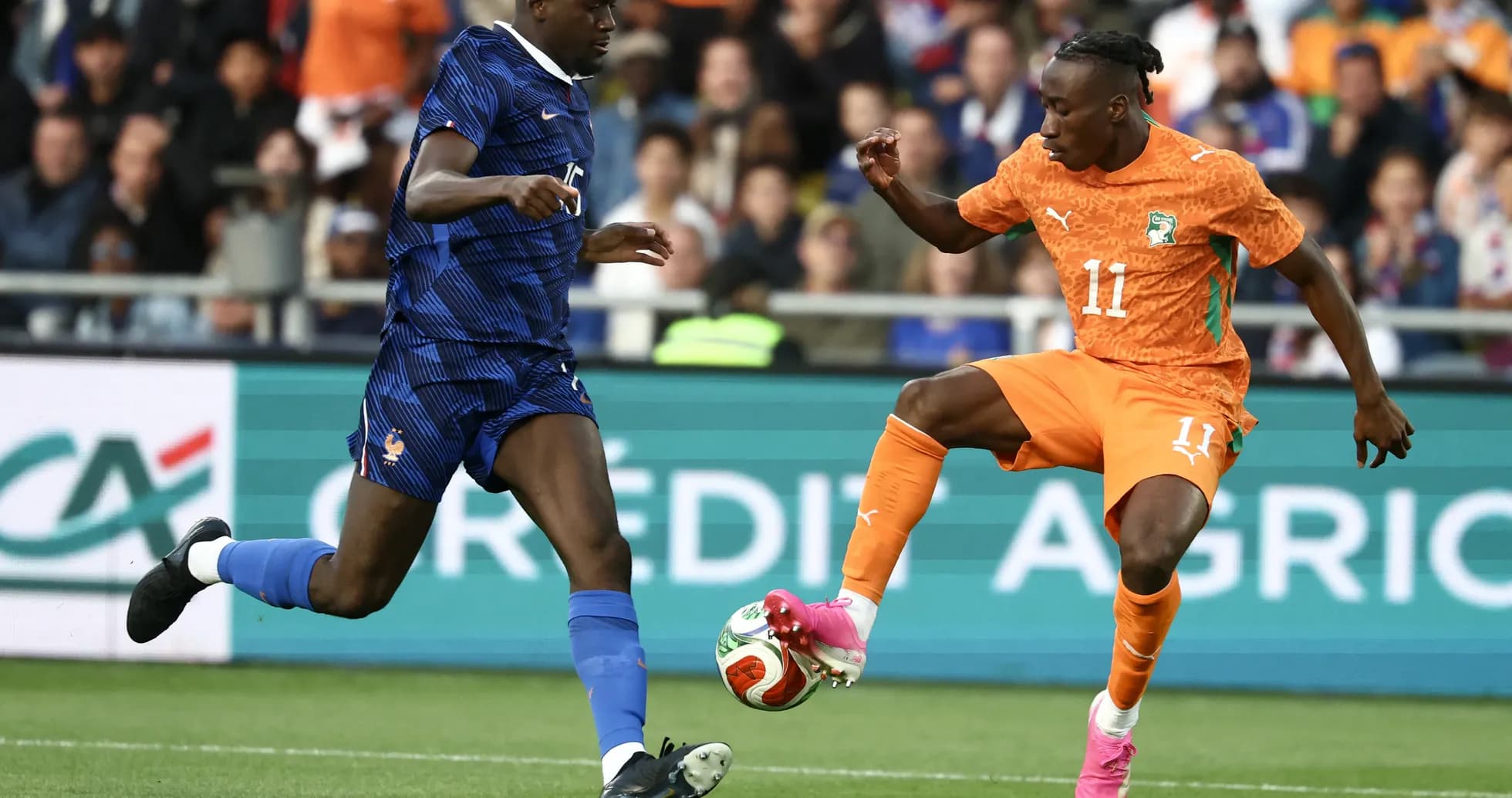 Two players contesting for the ball during match