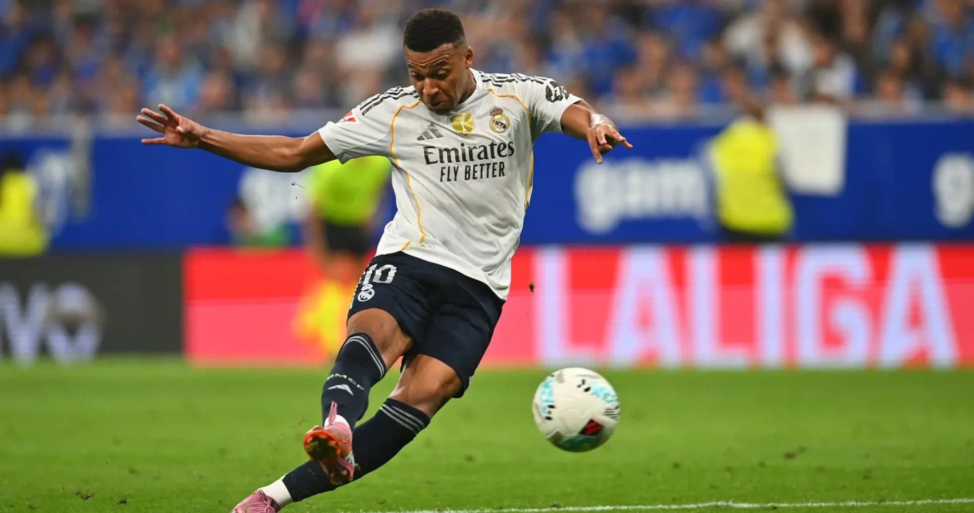 Real Madrid player taking a shot on goal