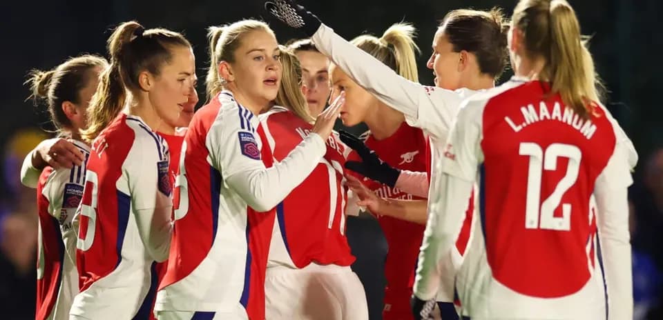 Arsenal W players celebrating during a match