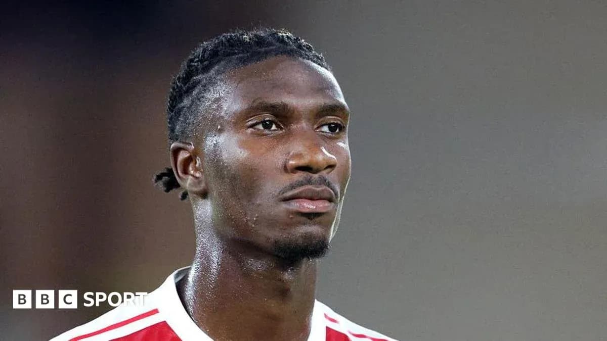 Player in red and white kit during match
