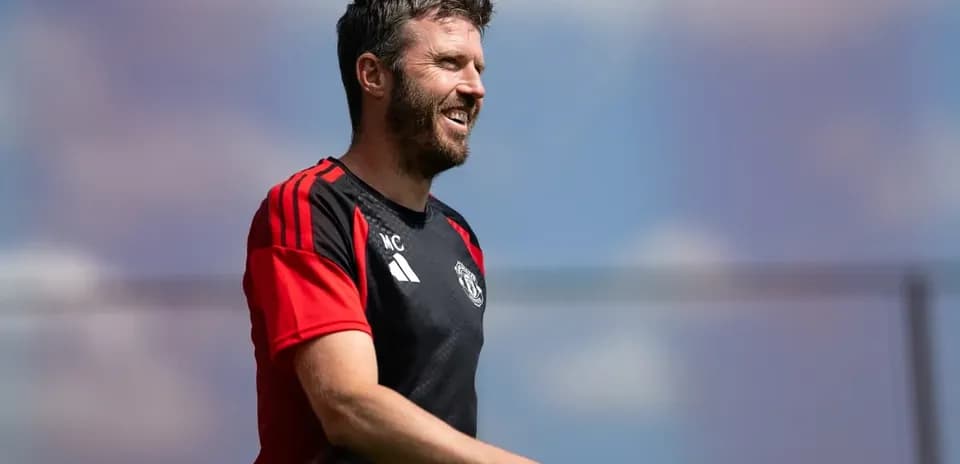 Coach in training kit during a sunny session