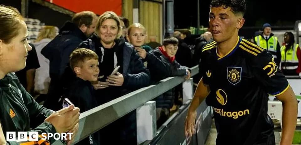 Player walking past fans after match at stadium