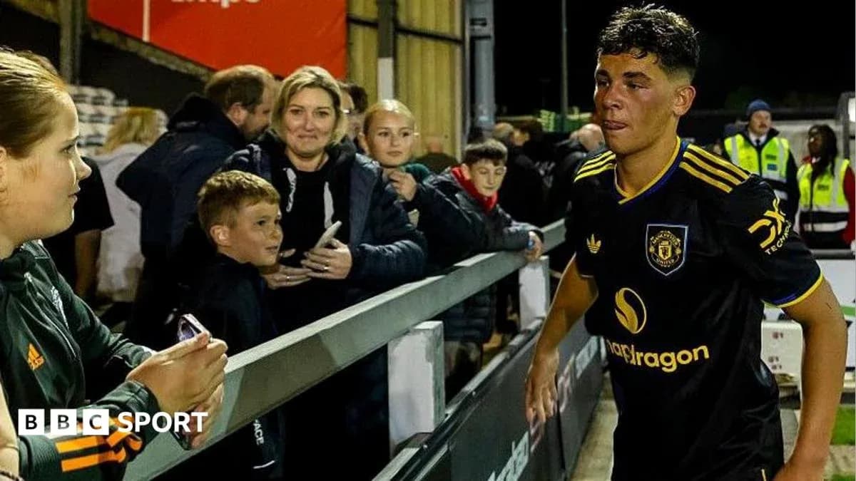 Player walking past fans after match at stadium