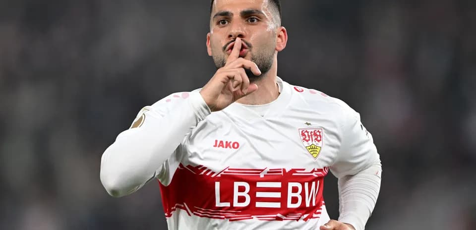 Player celebrating with shushing gesture after scoring