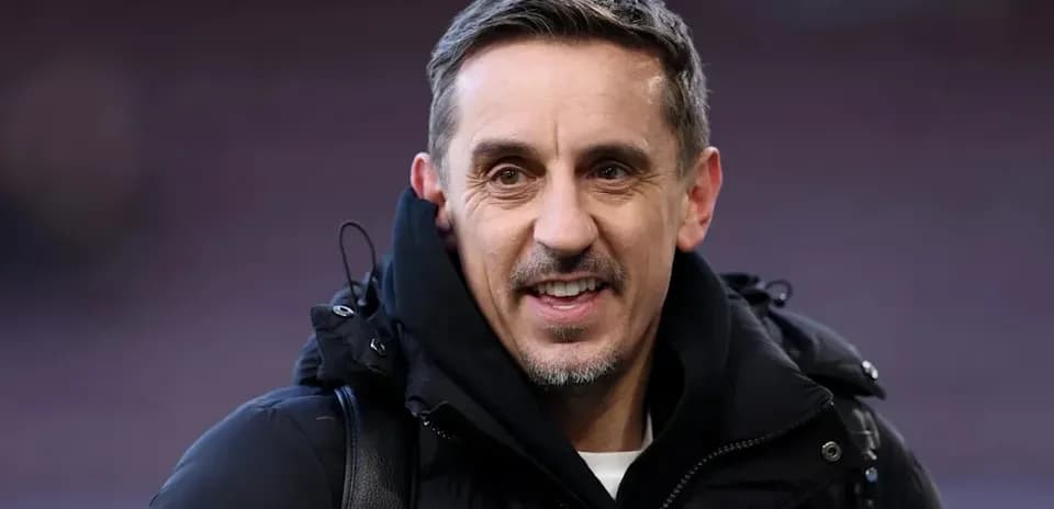 Man in a black jacket smiling at camera