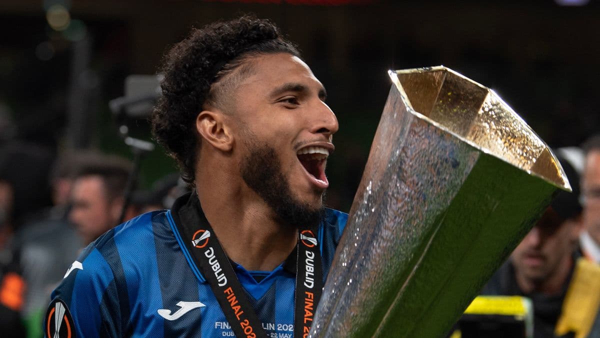 Player celebrating with trophy after match victory