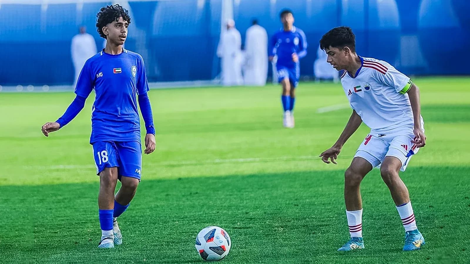 Al Nasr U23 player with ball against Shabab Al-Ahli U23