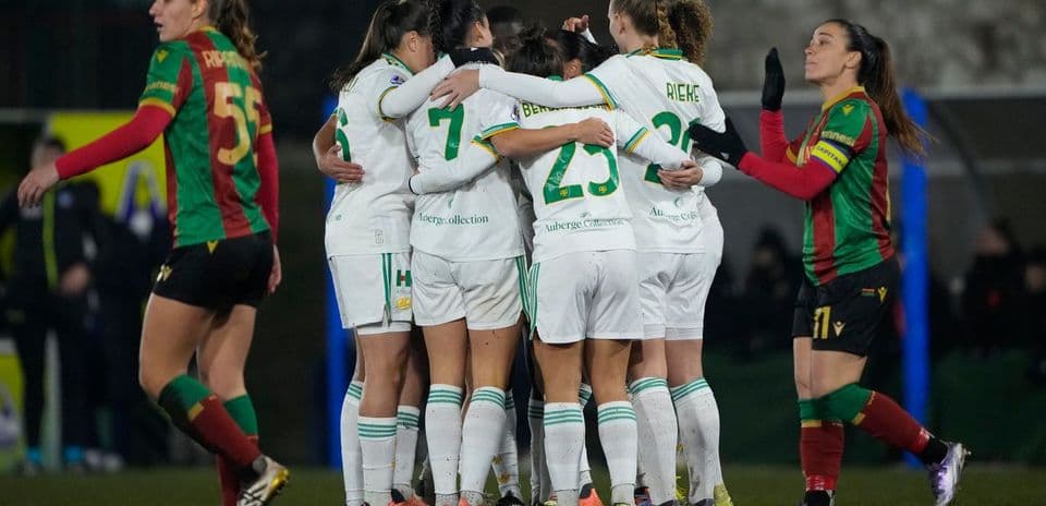Players celebrating a goal during a football match