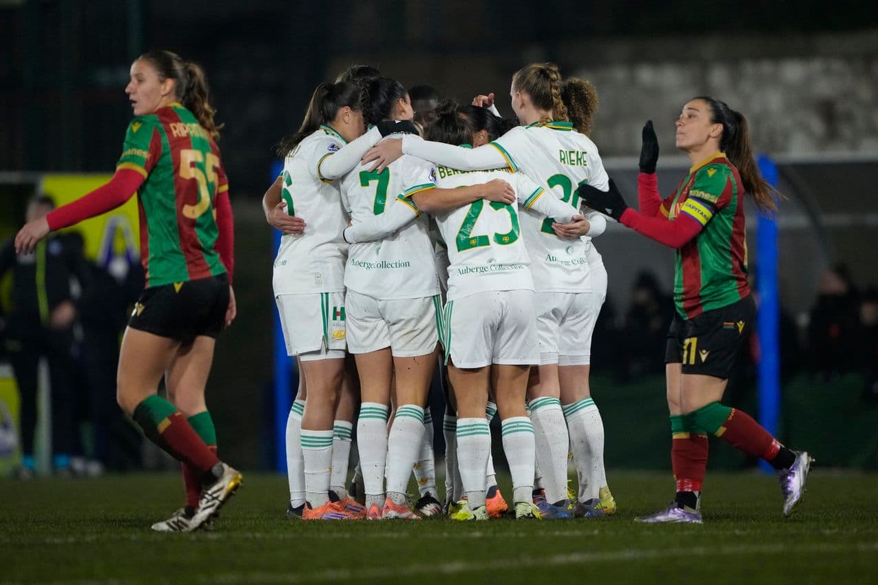 Players celebrating a goal during a football match