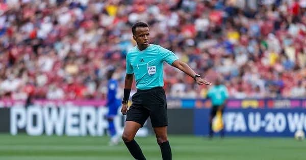 Referee signaling during a football match