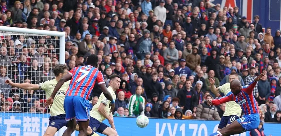 Crystal Palace player shooting on goal against Everton
