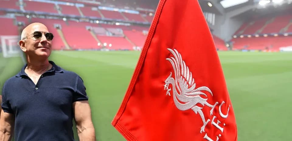 Person near Liverpool FC corner flag at stadium