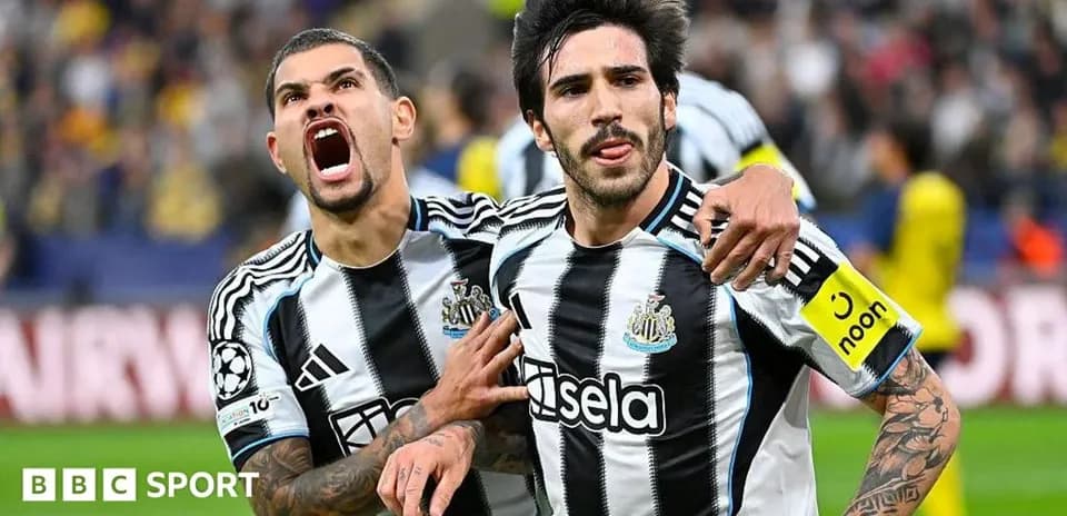 Newcastle players celebrating a goal together