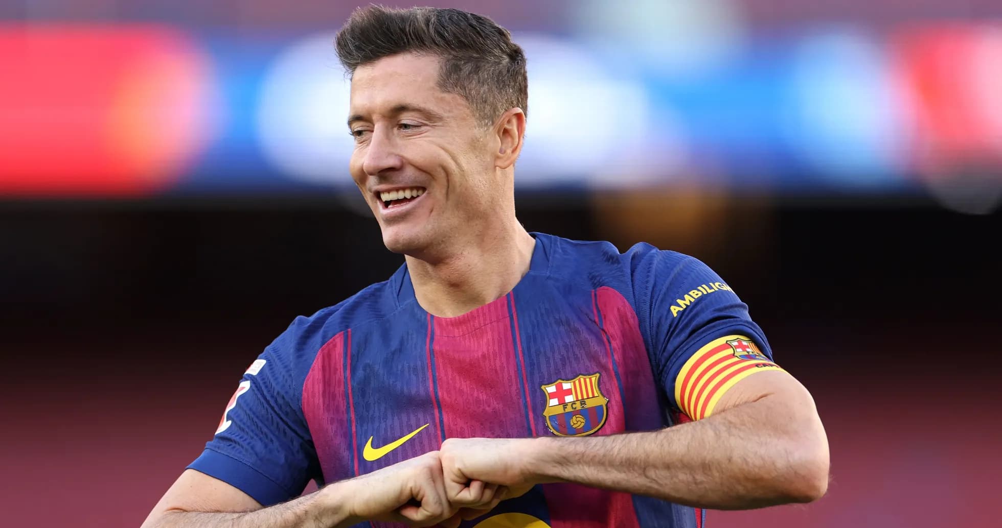 Player in Barcelona jersey celebrating on the pitch