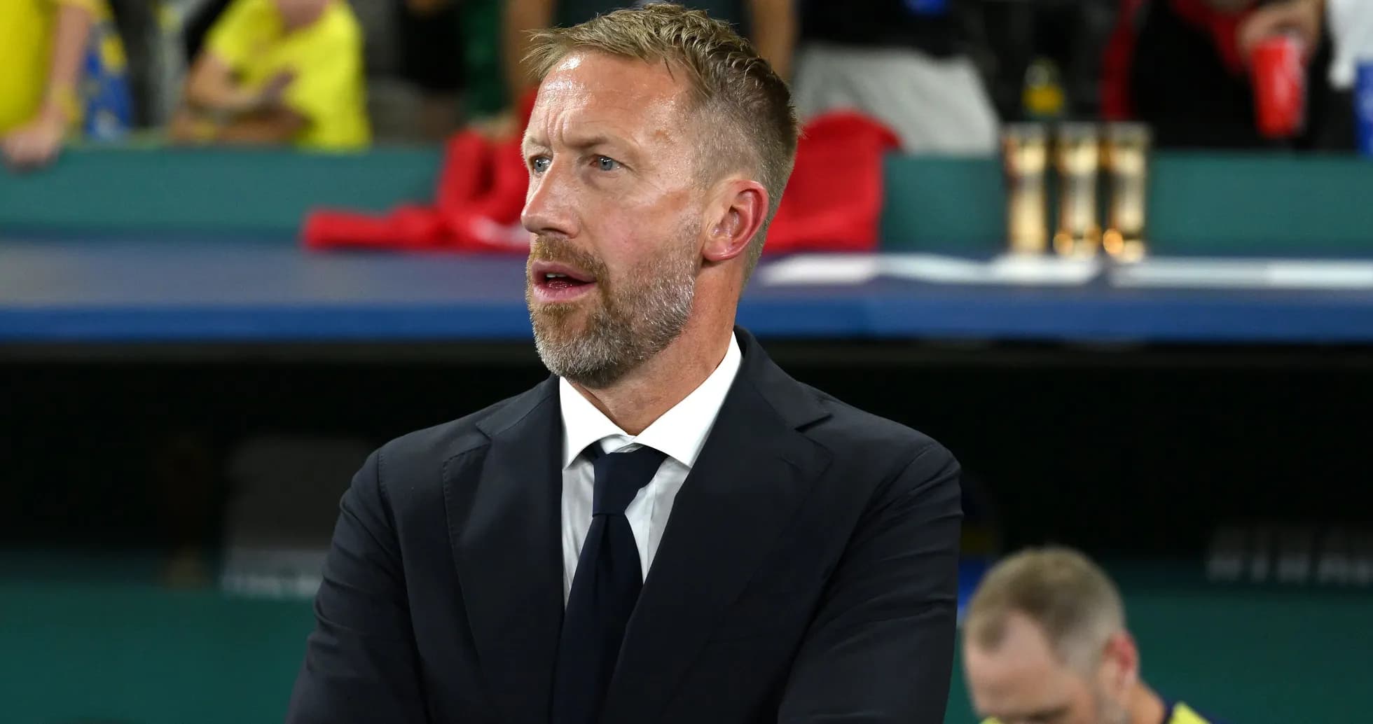 Coach observing match from the sidelines