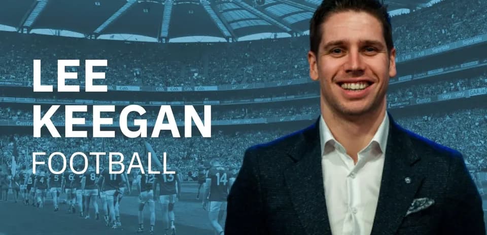 Lee Keegan smiling with football stadium background
