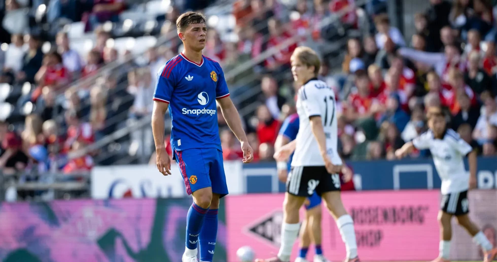 Player in blue Manchester United kit on field