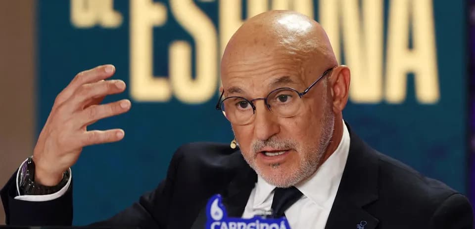 Person speaking at press conference with gesturing hands