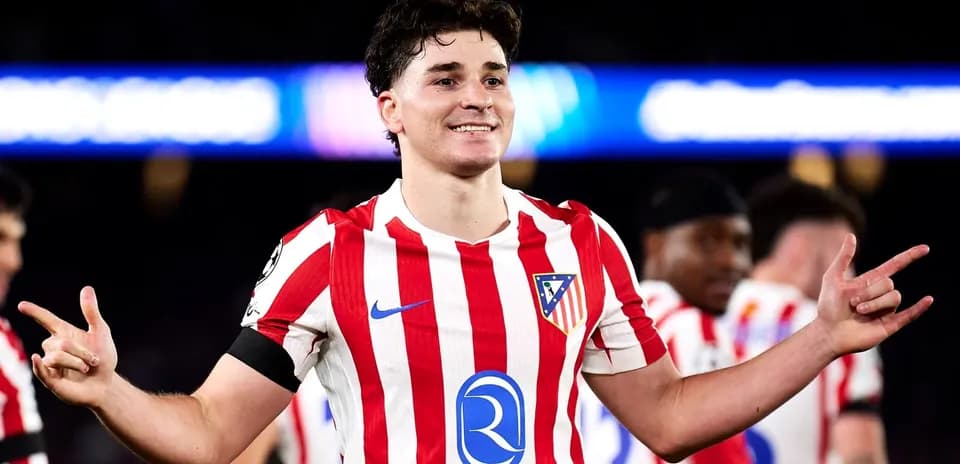 Atletico Madrid player celebrating with teammates