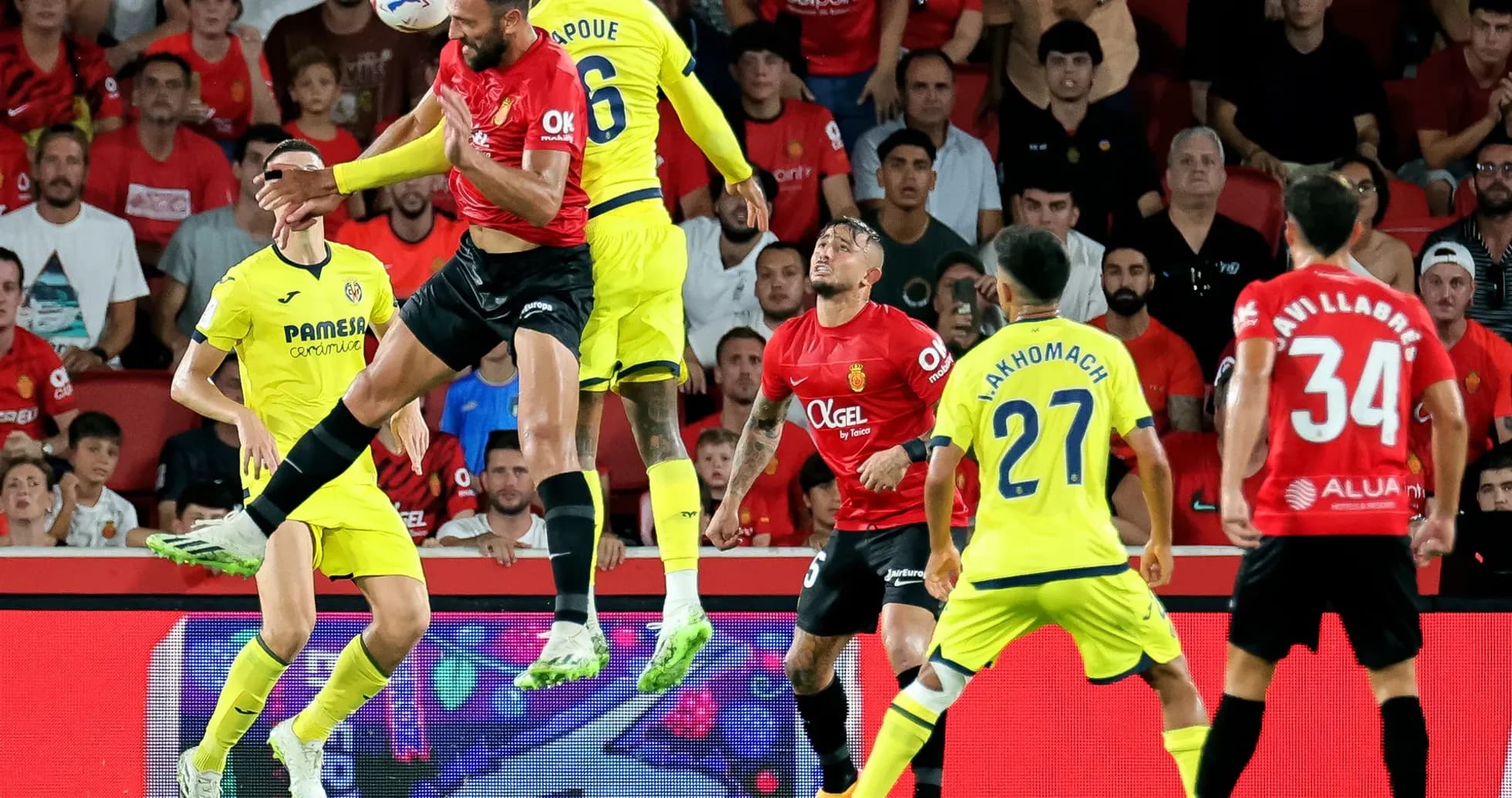 Players contesting a header during Mallorca match