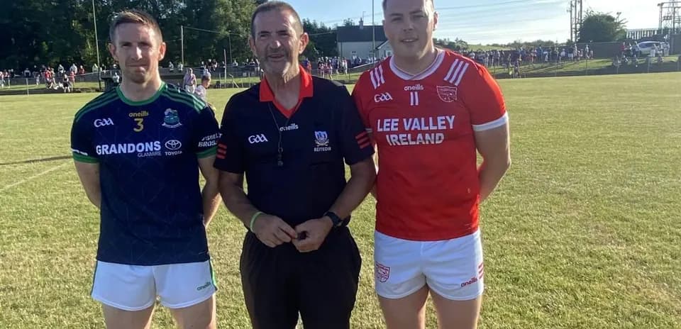 Two players and a referee before a match