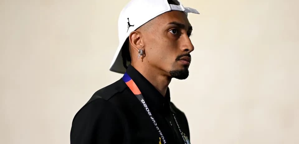 Person wearing cap and lanyard, side profile
