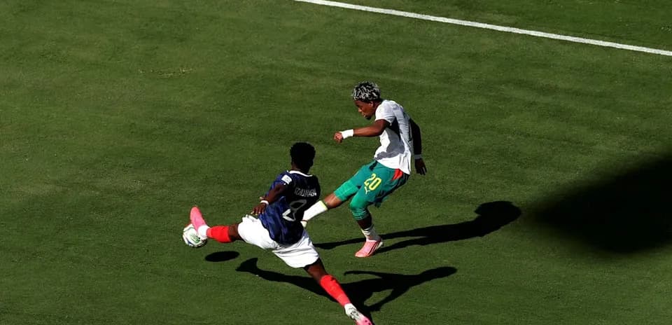 Player attempting to dribble past opponent on field
