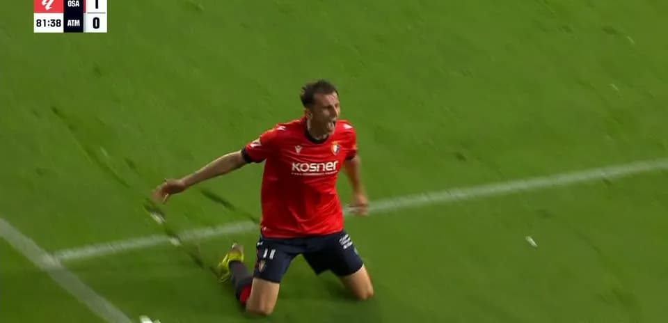 Osasuna player celebrating a goal against Atletico Madrid