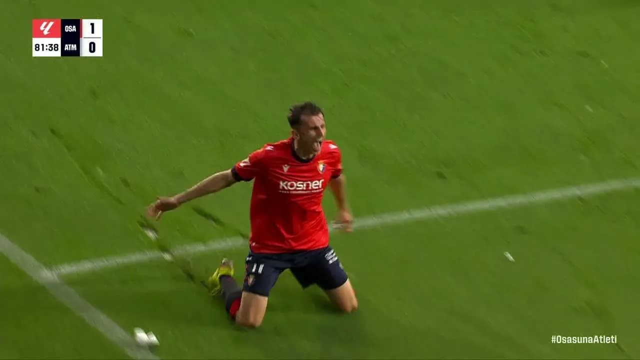 Osasuna player celebrating a goal against Atletico Madrid