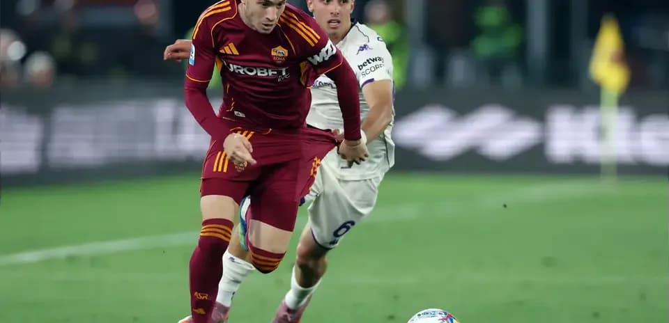 Player from AS Roma being challenged during match