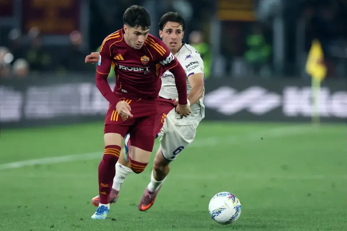Player from AS Roma being challenged during match