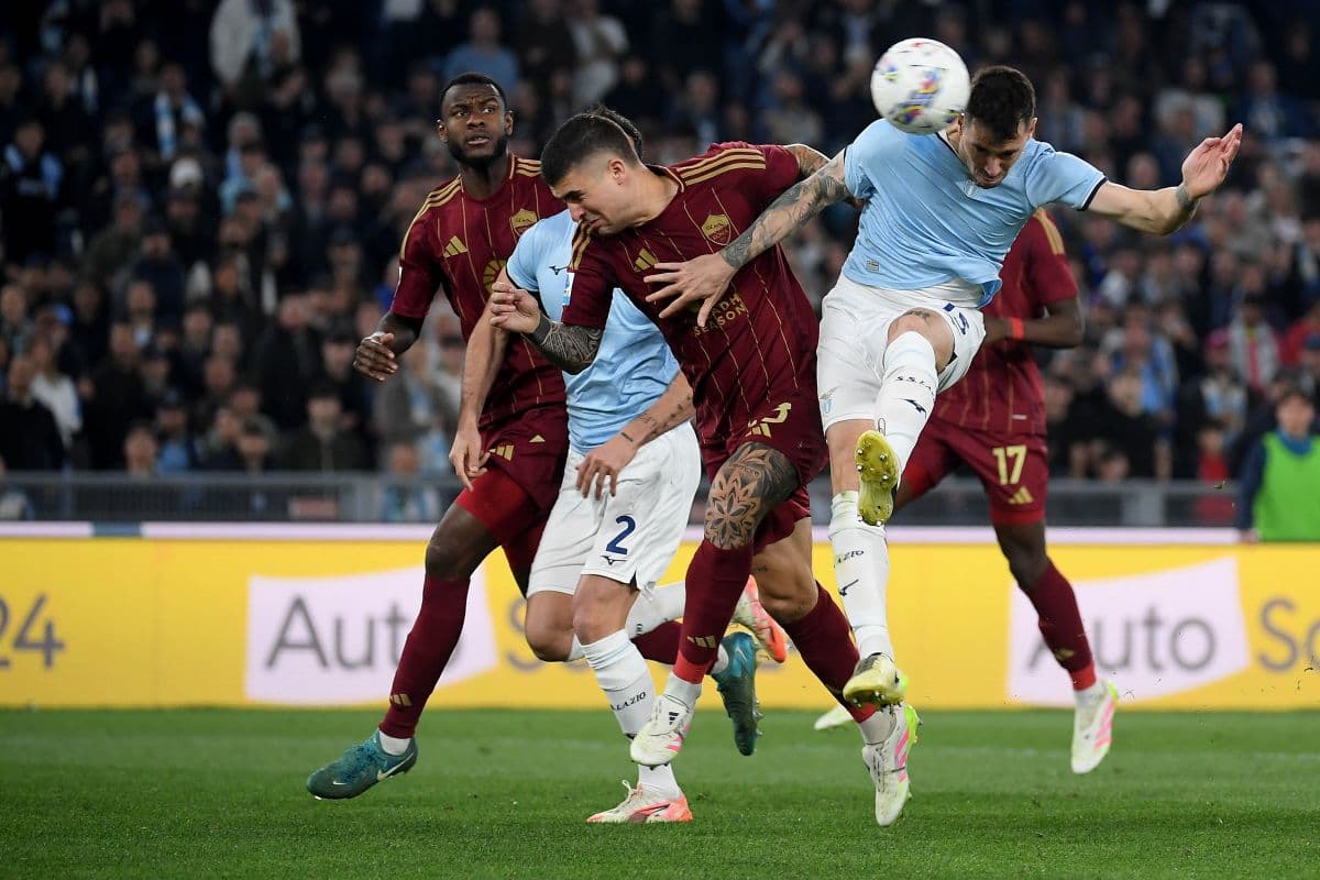 AS Roma players challenging Lazio for the ball